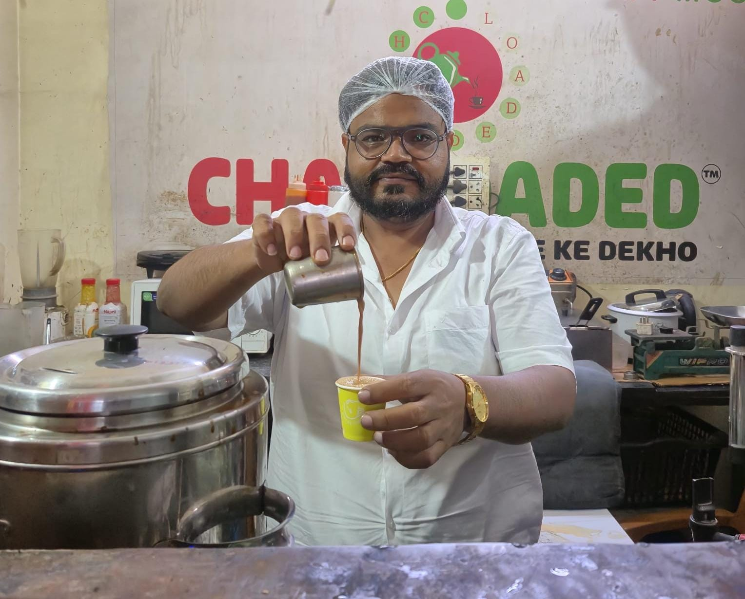 Chai Loaded owner pouring tea at the counter